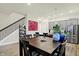 Bright dining area with dark wood table and chairs, near kitchen at 597 Steinbeck Pl, Carmel, IN 46032