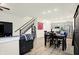 Open concept dining area with kitchen and staircase view at 597 Steinbeck Pl, Carmel, IN 46032