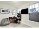 Home office with a desk, beanbag chair, and large window at 597 Steinbeck Pl, Carmel, IN 46032