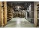 Unfinished basement with built-in shelving and concrete floor at 6634 Royal Oakland Pl, Indianapolis, IN 46236