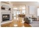 Open living room with hardwood floors and fireplace at 6634 Royal Oakland Pl, Indianapolis, IN 46236