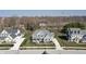 Aerial view of a residential neighborhood featuring well-maintained homes, mature trees, and scenic surroundings at 78 Chatham Brook Dr, Westfield, IN 46074