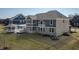 Lush backyard boasts a covered patio, gazebo, and beautiful landscaping, perfect for relaxation and outdoor entertainment at 78 Chatham Brook Dr, Westfield, IN 46074
