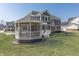 Inviting backyard with gazebo features a well-kept lawn, ideal for outdoor activities and relaxation at 78 Chatham Brook Dr, Westfield, IN 46074