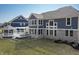 Scenic backyard featuring a covered patio, gazebo, and mature trees, offering a tranquil and inviting outdoor space at 78 Chatham Brook Dr, Westfield, IN 46074