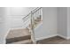Basement carpeted stairs with simple railing at 78 Chatham Brook Dr, Westfield, IN 46074