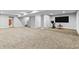 Finished basement area featuring neutral carpet, exercise equipment, and stairs at 78 Chatham Brook Dr, Westfield, IN 46074