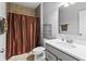 Updated bathroom featuring a modern vanity, shower with copper-colored curtain, and updated fixtures at 78 Chatham Brook Dr, Westfield, IN 46074