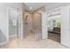 Bathroom with a glass shower, neutral tile, and easy access to the main bedroom at 78 Chatham Brook Dr, Westfield, IN 46074