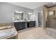Luxurious bathroom featuring double sinks, a soaking tub, and a frameless glass shower at 78 Chatham Brook Dr, Westfield, IN 46074