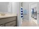A partial view to a bathroom featuring a vanity with drawers and a view to the shower and a bedroom at 78 Chatham Brook Dr, Westfield, IN 46074