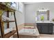 Relaxing bathroom with a soaking tub and a decorative ladder at 78 Chatham Brook Dr, Westfield, IN 46074