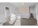 Charming bedroom with floral wallpaper and adjacent bathroom at 78 Chatham Brook Dr, Westfield, IN 46074