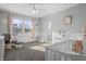 Bright Bedroom with crib, rocking chair, and large windows at 78 Chatham Brook Dr, Westfield, IN 46074
