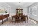 Formal dining room with hardwood floors, wainscoting, elegant lighting, and furniture at 78 Chatham Brook Dr, Westfield, IN 46074
