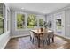 Sunlit dining room with backyard view, table, seating for four, and wood floors at 78 Chatham Brook Dr, Westfield, IN 46074