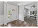 Welcoming entryway featuring hardwood floors and views into the home office with french doors at 78 Chatham Brook Dr, Westfield, IN 46074