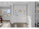 Bright entryway with hardwood floors and white front door at 78 Chatham Brook Dr, Westfield, IN 46074