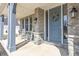 Charming front porch with grey stone columns and rocking chairs at 78 Chatham Brook Dr, Westfield, IN 46074