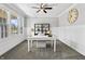 Spacious home office featuring neutral paint, carpet, ceiling fan, large window, and a modern bookshelf at 78 Chatham Brook Dr, Westfield, IN 46074