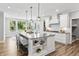 Bright kitchen with a large island, breakfast bar, and modern stainless steel appliances at 78 Chatham Brook Dr, Westfield, IN 46074
