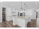 Elegant kitchen featuring white cabinets and granite island at 78 Chatham Brook Dr, Westfield, IN 46074