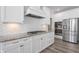 Modern kitchen features white cabinets, granite countertops, and gas cooktop at 78 Chatham Brook Dr, Westfield, IN 46074