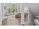 Open concept living room features a fireplace, high windows, and hardwood floors at 78 Chatham Brook Dr, Westfield, IN 46074