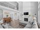 Open living room showcasing a fireplace and two-story ceiling at 78 Chatham Brook Dr, Westfield, IN 46074