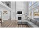 Two-story living room with fireplace and built-in shelving at 78 Chatham Brook Dr, Westfield, IN 46074