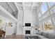 High-ceilinged living room with fireplace and large windows at 78 Chatham Brook Dr, Westfield, IN 46074