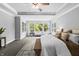 Bright main bedroom with large windows, tray ceiling, carpeted floor and stylish decor at 78 Chatham Brook Dr, Westfield, IN 46074