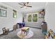 Bright playroom featuring carpeted floors, a ceiling fan, and ample space for activities at 78 Chatham Brook Dr, Westfield, IN 46074