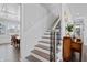 Elegant staircase with dark wood and iron railing at 78 Chatham Brook Dr, Westfield, IN 46074