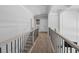 Upstairs hallway with staircase and neutral carpeting at 78 Chatham Brook Dr, Westfield, IN 46074