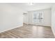 Bright living room with wood-look floors and windows at 7820 Bryden Dr, Fishers, IN 46038