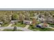 Scenic aerial view of a home nestled in a quiet neighborhood with mature trees and well-maintained lawns at 7906 Hampton Pl, Fishers, IN 46038