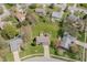 Expansive aerial view of a home with a large backyard, surrounded by lush greenery and neighboring houses at 7906 Hampton Pl, Fishers, IN 46038