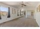 Main bedroom with ceiling fan, neutral carpet, natural light, and a mirrored closet at 7906 Hampton Pl, Fishers, IN 46038