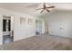 Spacious main bedroom with ceiling fan, neutral carpet, access to bathroom, and walk-in closets at 7906 Hampton Pl, Fishers, IN 46038