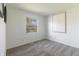 Bright bedroom featuring neutral carpet, fresh white walls, natural lighting, and minimalist art at 7906 Hampton Pl, Fishers, IN 46038
