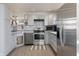 Beautiful kitchen featuring stainless steel appliances, updated cabinets, subway tile backsplash, and stylish decor at 7906 Hampton Pl, Fishers, IN 46038