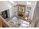 Bright living room with stone fireplace, skylights, modern furniture, and seamless indoor-outdoor flow at 7906 Hampton Pl, Fishers, IN 46038