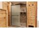 Modern shower features sleek glass doors, attractive tiles, and stylish fixtures inside at 7906 Hampton Pl, Fishers, IN 46038