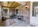 This sunroom features lots of natural light, brick walls and seating area at 7906 Hampton Pl, Fishers, IN 46038