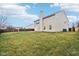 Level grassy backyard with a wooden fence and plenty of space at 7988 Kersey Dr, Indianapolis, IN 46236