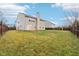 Spacious backyard, perfect for outdoor activities, with a large grassy area at 7988 Kersey Dr, Indianapolis, IN 46236