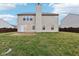 Large backyard with grassy area and wooden privacy fence at 7988 Kersey Dr, Indianapolis, IN 46236