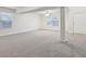 Spacious finished basement with neutral carpeting and lots of natural light at 7988 Kersey Dr, Indianapolis, IN 46236