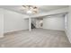 Bright, open basement featuring neutral carpeting and ceiling fan at 7988 Kersey Dr, Indianapolis, IN 46236
